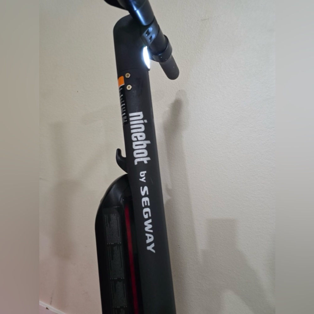 Black Scooter with Sleek Design and Minimalist Aesthetic